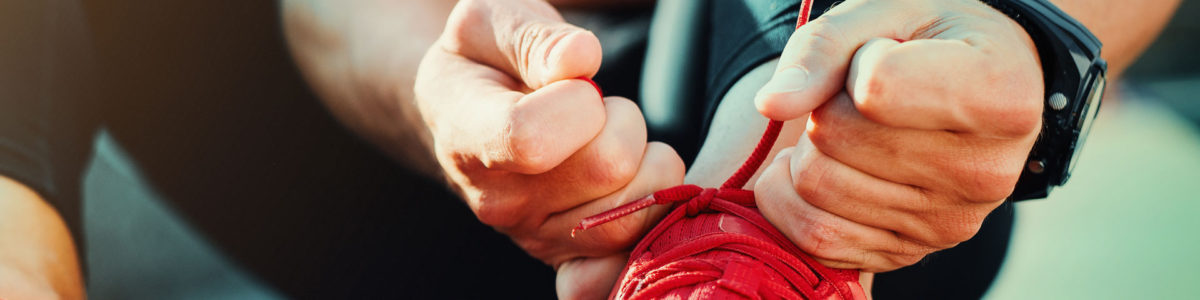 Athlete preparing his laces in order to make the cut